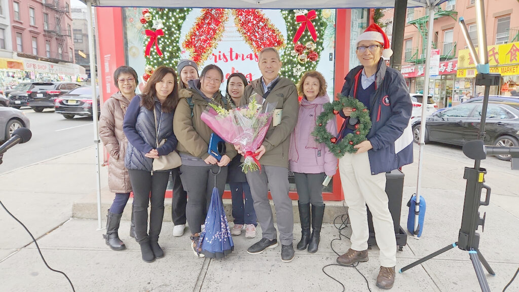 Christmas Caroling at the Kiosk Chinatown NYC